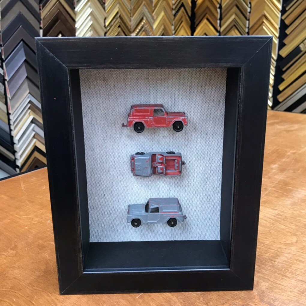 shadow box with old trucks